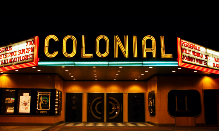 The colonial theatre with its neon lights on at night