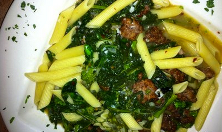 a picture of pasta, spinach, and meatballs