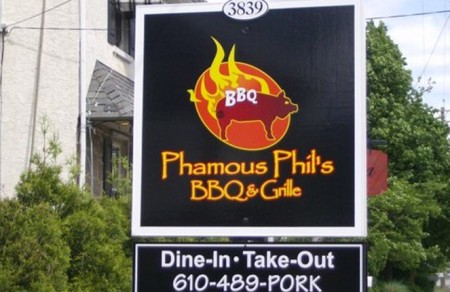 a picture of a phamous phils bbq restaurant logo